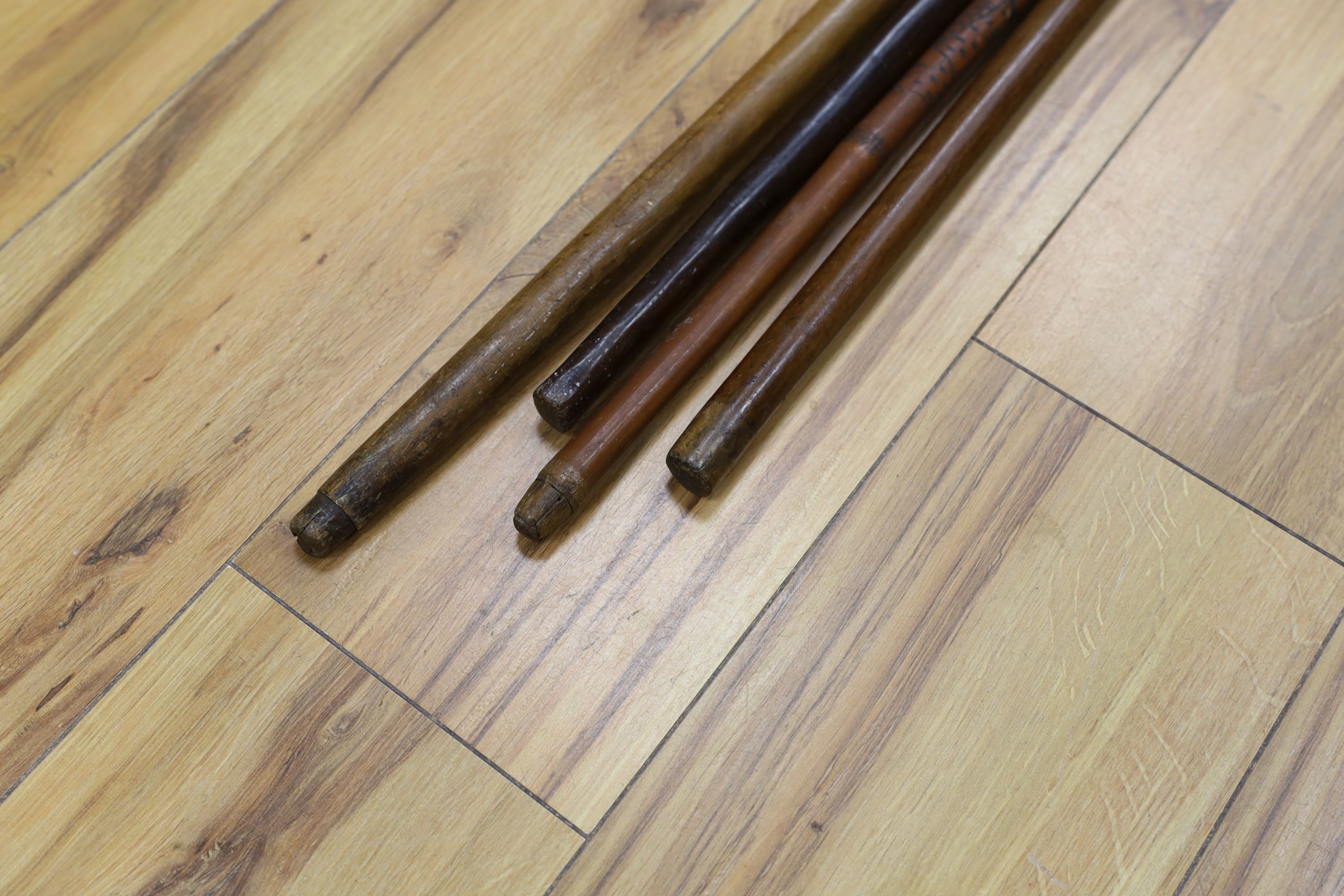 Two 19th century Greek walking sticks, a Japanese walking cane and an African cane